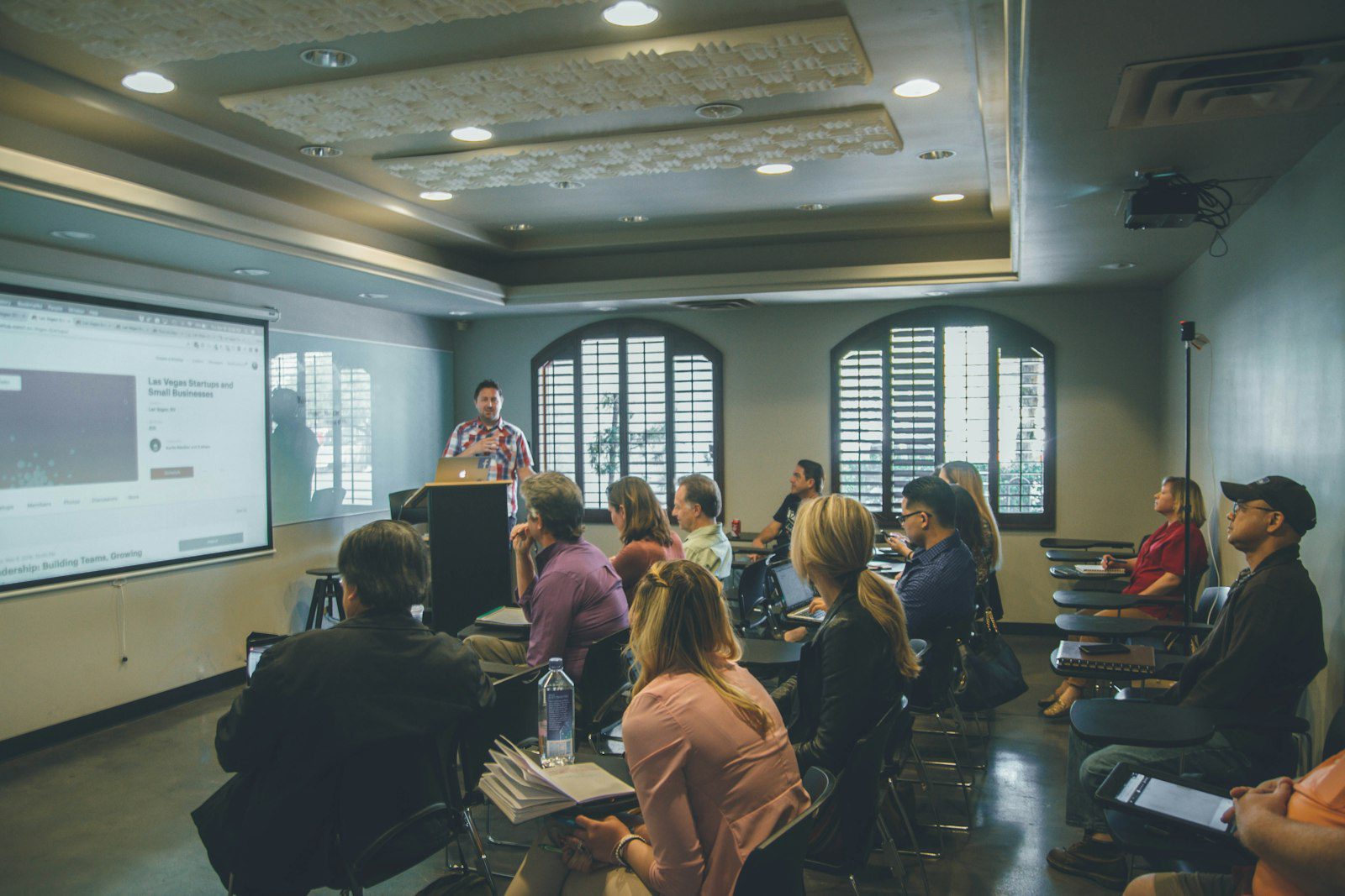 Business school classroom with students preparing for management entrance exam